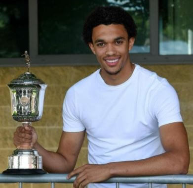 Dianne Arnold son Trent Alexander-Arnold after winning the trophy.